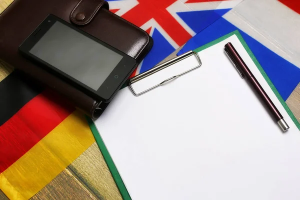 Blank paper on wooden textural desk with mobile phone — Stock Photo, Image