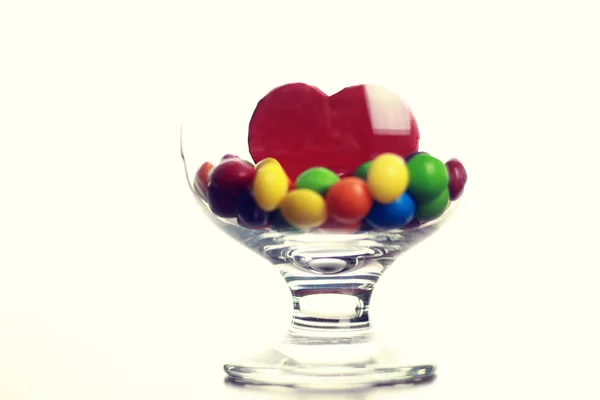 Bicchiere con pillola di caramelle — Foto Stock