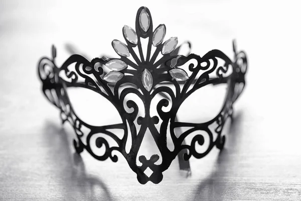Carnival mask on the table. The subject of camouflage on a date — Stock Photo, Image