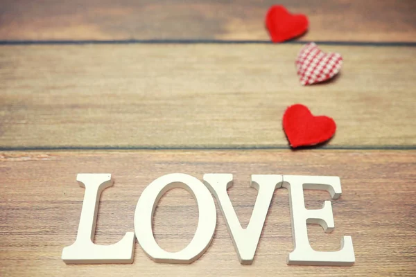 Woord Love uit houten letters op achtergrond — Stockfoto