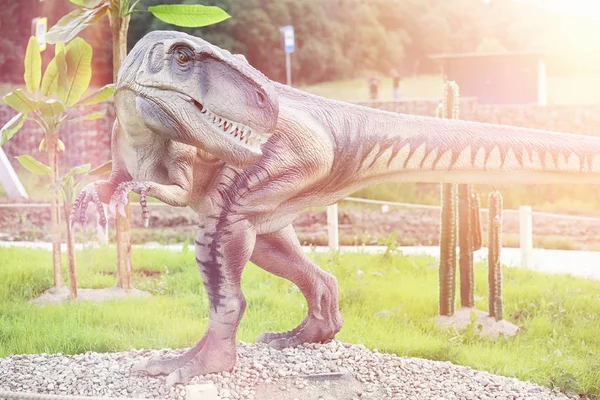 Park of dinosaurs. A dinosaur on the background of nature. Toy d — Stock Photo, Image