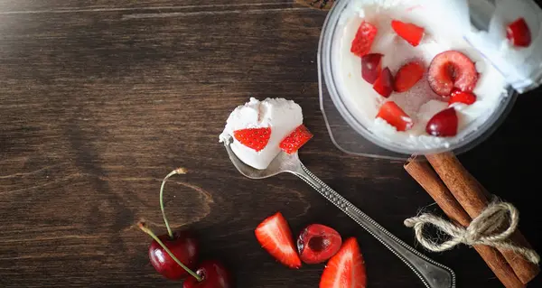 Fresh yogurt with berries. Ice cream in a bowl with fresh and ju