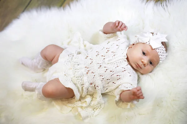 Portrait of a beautiful baby girl in a white dress — Stock Photo, Image