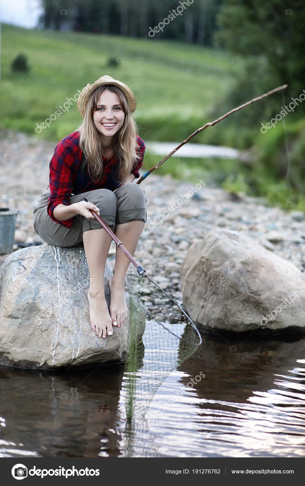 Girl by the river with a fishing rod Stock Photo by ©alexkich