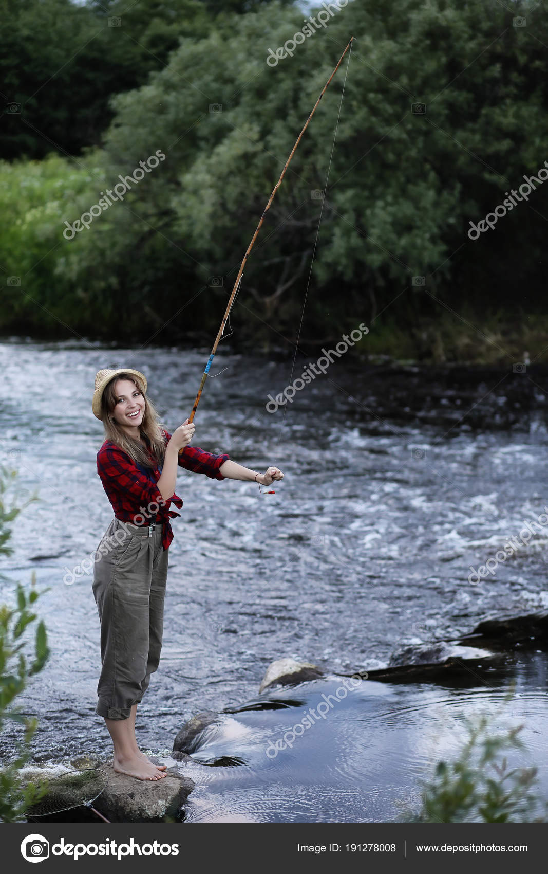 Girl by the river with a fishing rod — Stock Photo © alexkich
