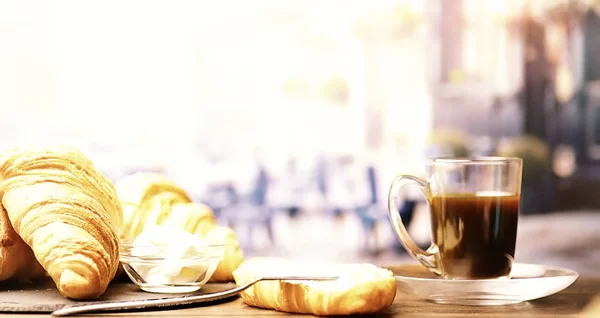 Fresh pastries on the table. French flavored croissant and coffe — 스톡 사진