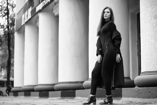 Girl in a coat black and white photo — Stock Photo, Image