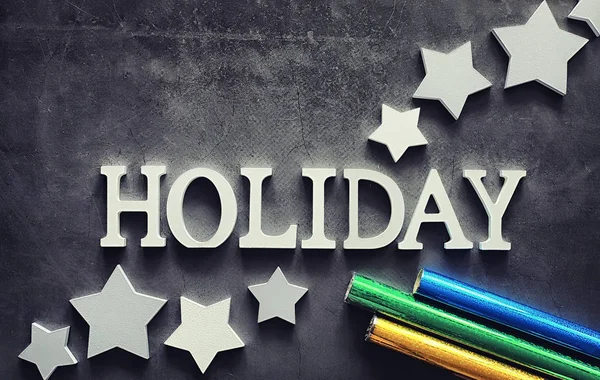 Background concept. The inscription holiday on a dark background — Stock Photo, Image