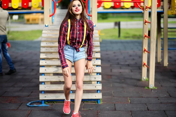 Menina bonito em uma maquiagem de palhaço — Fotografia de Stock