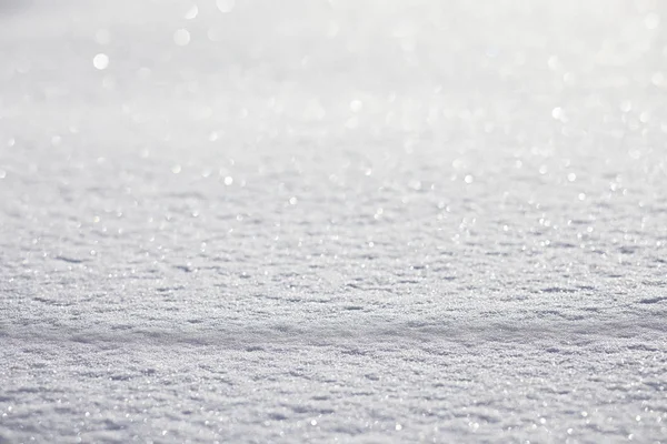 The texture of the snow. Winter rainfall. Tracks on a snowy road — Stock Photo, Image