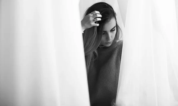 Young girl in a sweater in a room — Stock Photo, Image