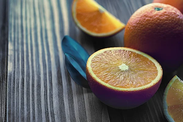 Orange citrus fruit on stone table. Orange background.