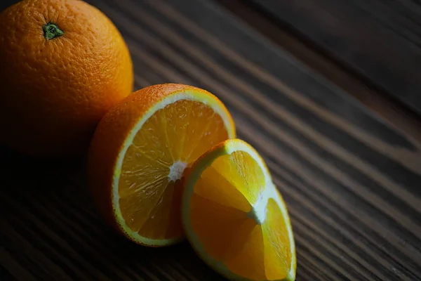 Orange citrus fruit on stone table. Orange background.