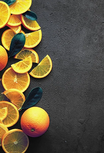 Orange citrus fruit on stone table. Orange background.