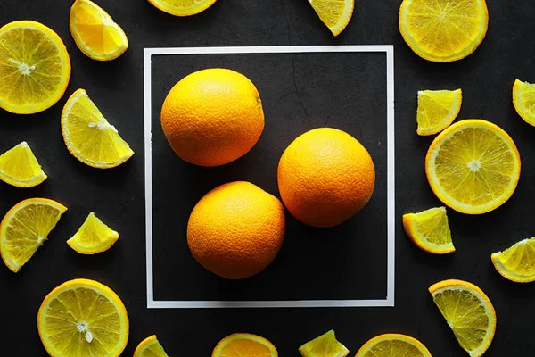 Orange citrus fruit on stone table. Orange background.