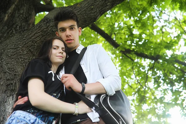 Young couple on the first date in the city park