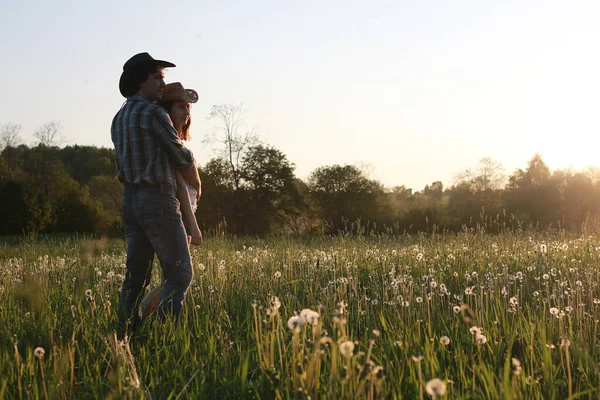 Cute couple on a walk by the countryside summer