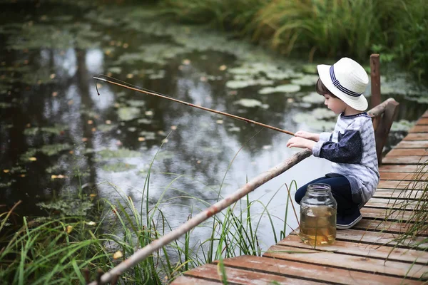 Young scouts. Children on a camping trip. Fish for fishing on a pond and river. Grandmother\'s vacation in the village.