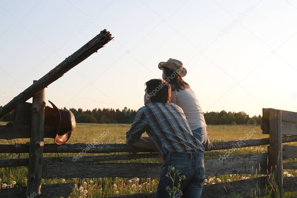 Cute couple on a walk by the countryside summer