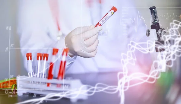 A scientist researcher in the laboratory is testing drugs for treatment of viral pneumonia. Coronovirus blood test of infected patients. World pandemic.