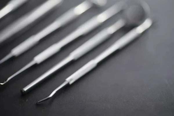 Equipment for the dental office. Orthopedic Instruments. Dental technician with work tools. Dentist metal tools.