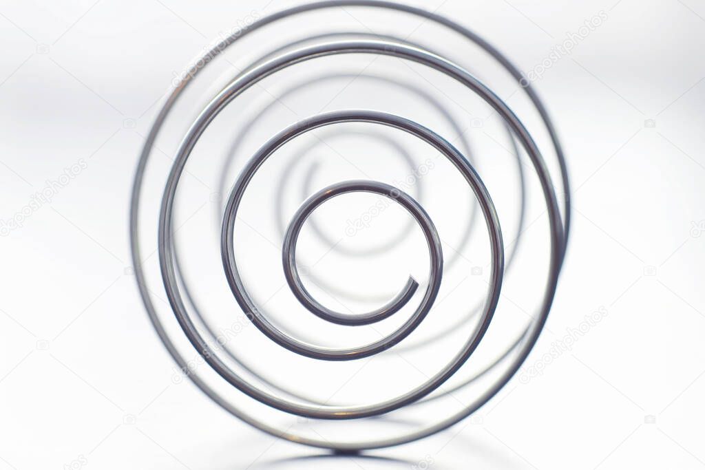 Metal spiral. The concept endless turns. Golden ratio. The concept of memories and life path.