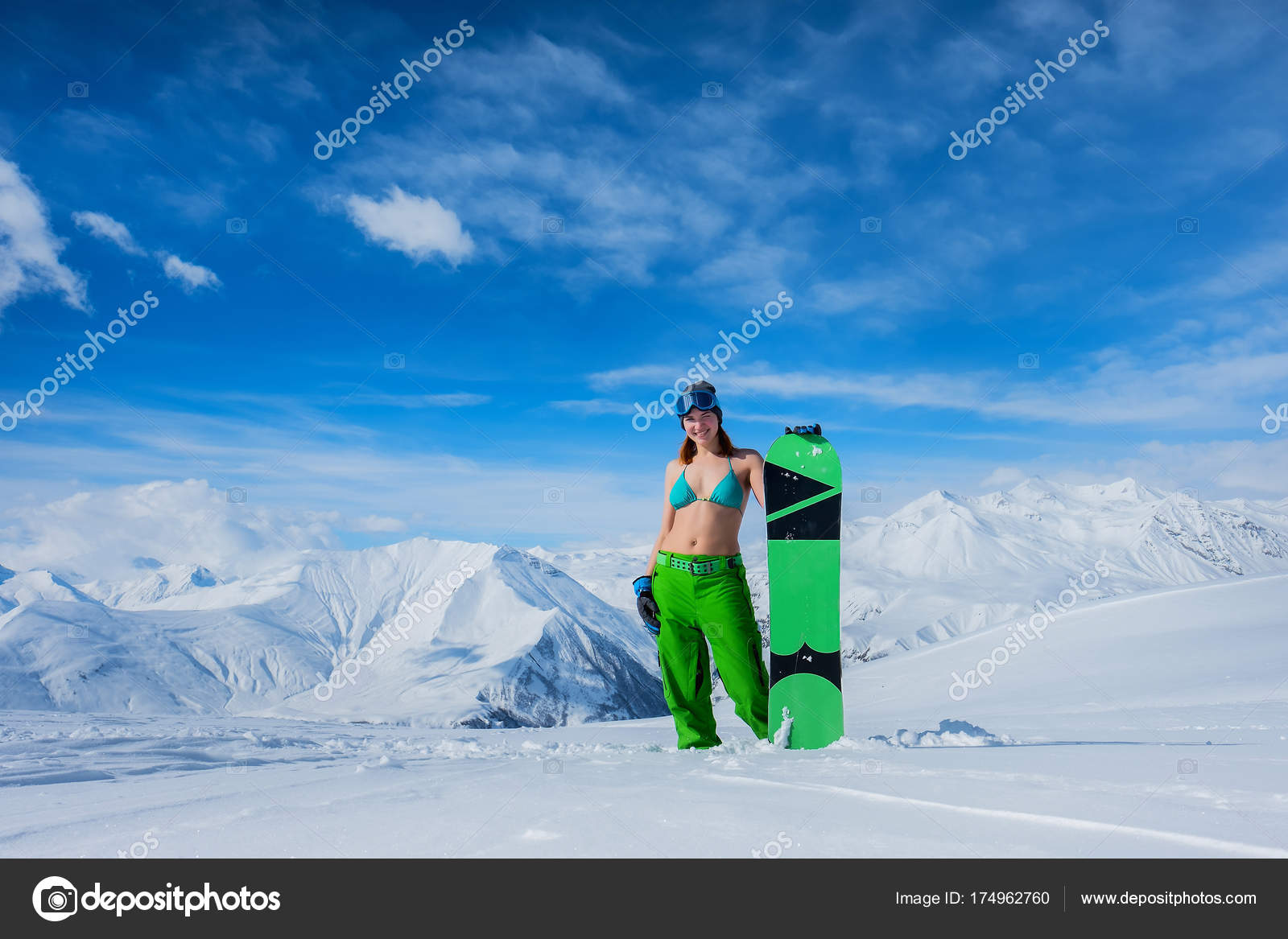 Girl with snowboard in a swimsuit against the background of snow Stock  Photo by ©hayoshka@gmail.com 174962760