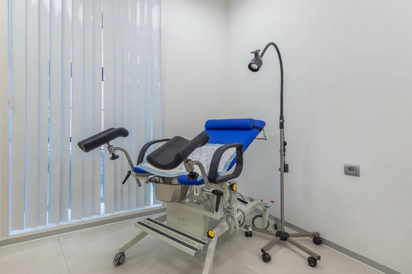 Gynecological examination table in the clinic