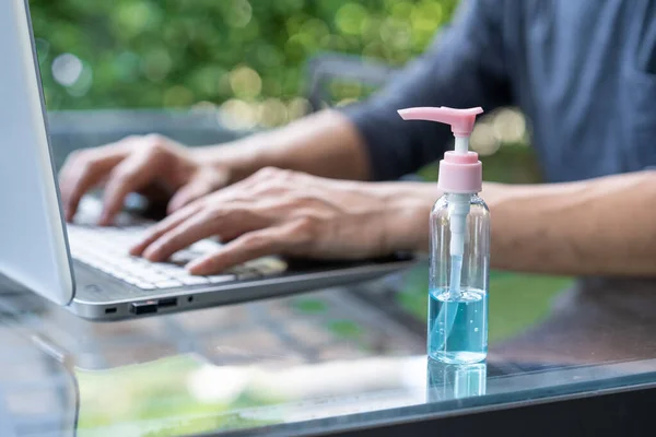 Work from home and alcohol sanitizer in pump bottle. health care concept