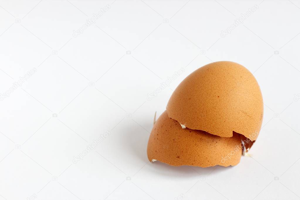 Broken egg shell on the white background.