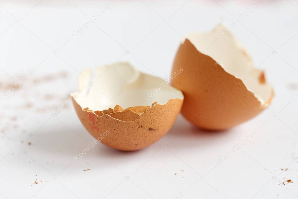 Broken egg shell on the white background.