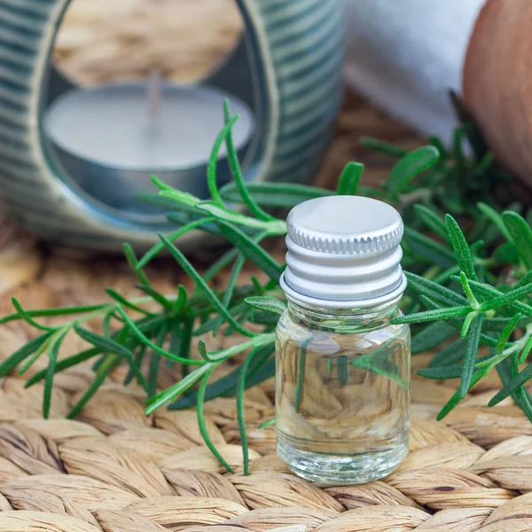 Rosemary Essential Oil Glass Woven Mat Spa Background Square Format — Stock Photo, Image