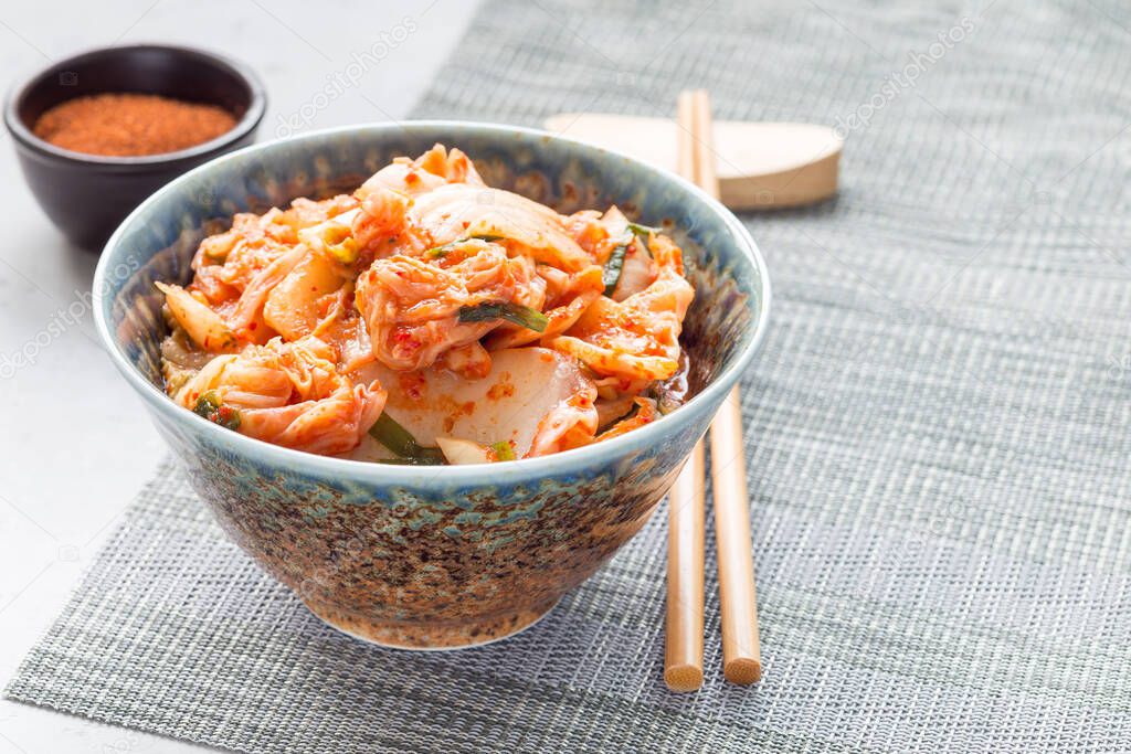 Kimchi cabbage. Korean appetizer in a bowl, horizontal, copy space