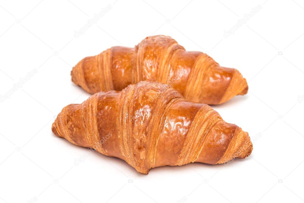 Two fresh croissant isolated on a white background,