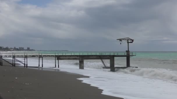 Beautiful seascape with tide and lonely pier — Stock Video