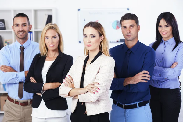 Joven empresaria con equipo empresarial — Foto de Stock