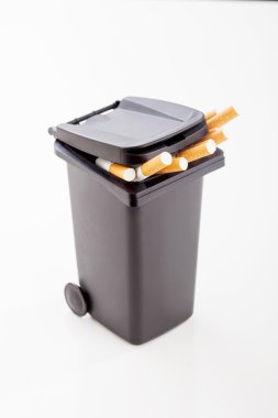 Bunch of cigarettes in the black trash canon  clipart