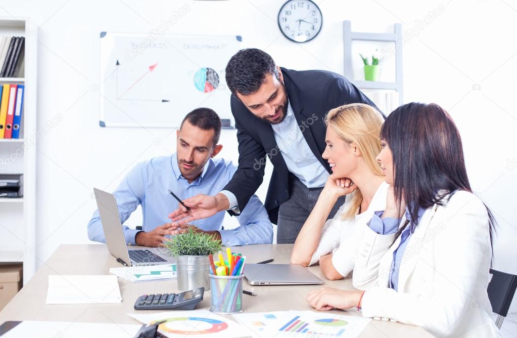 Business People Having Meeting In Office