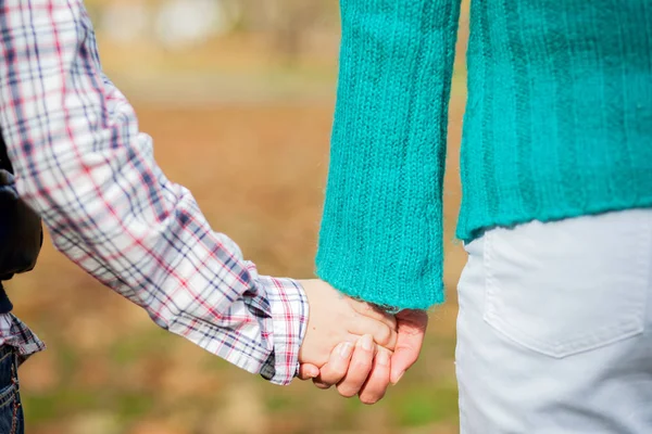 Grandmother and grandson holding hands — Stock Photo, Image