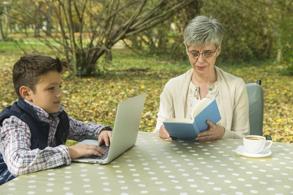 Grandson and grandmother in the park — Stock Photo, Image