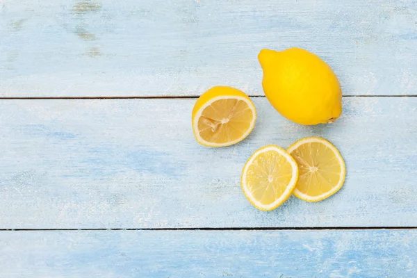 Lemon on blue wooden board — Stock Photo, Image