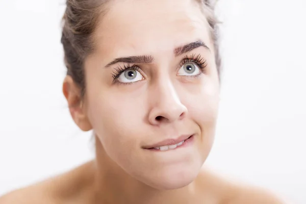 Portrait of young woman who is wondering something — Stock Photo, Image