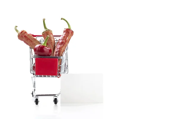 Red hot chili peppers in supermarket trolley — Stock Photo, Image