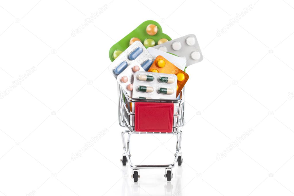 Colorful drugs and pills in a shopping cart