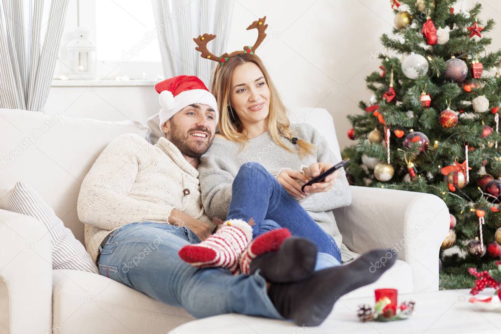 Couple in love watching TV