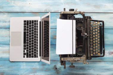 Old typewriter and laptop