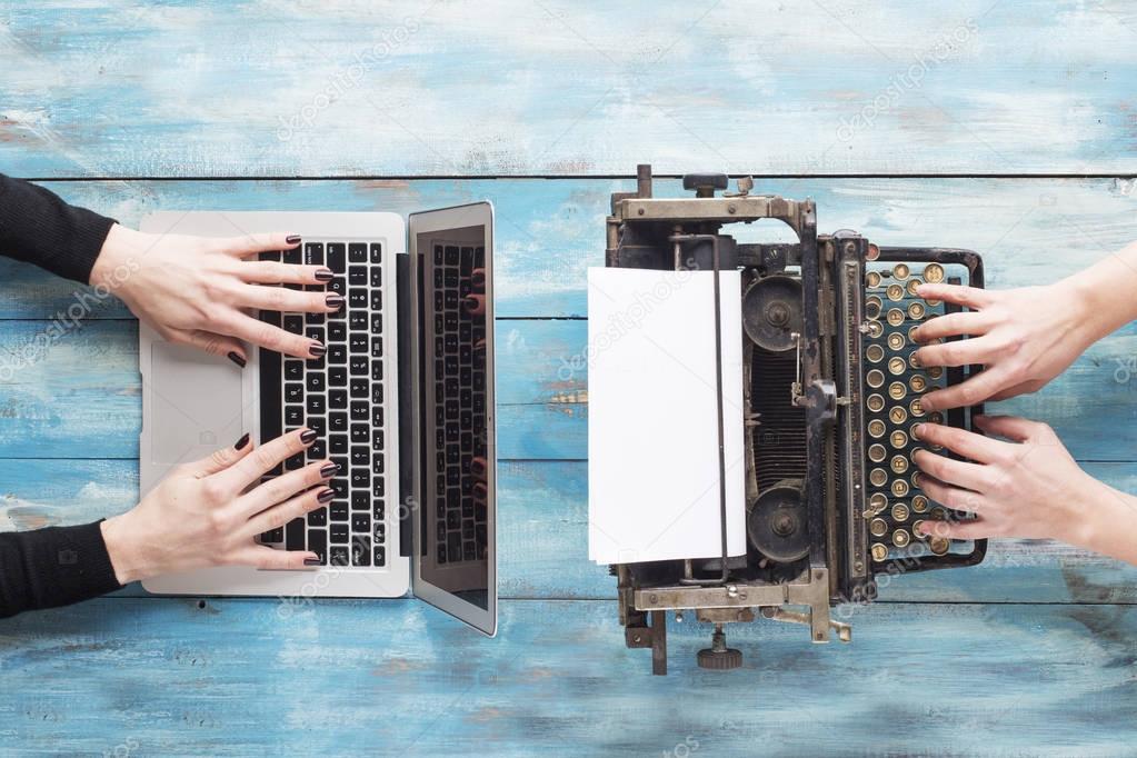 Old typewriter and laptop