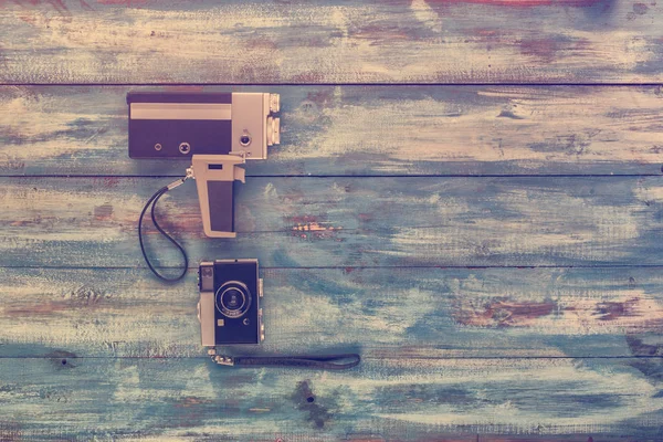 Video and photo camera on wooden board — Stock Photo, Image