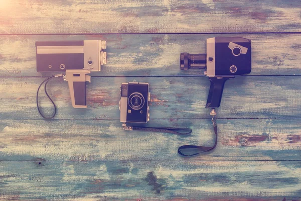 Video and photo camera on vintage background — Stock Photo, Image