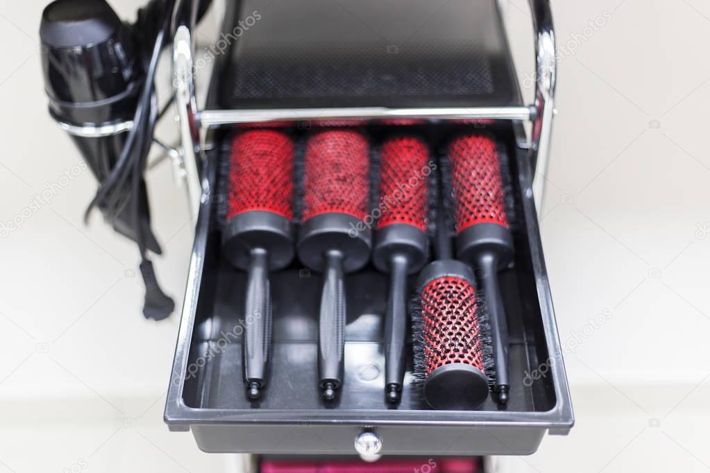 Hairbrushes in the drawer in hairstyle salon